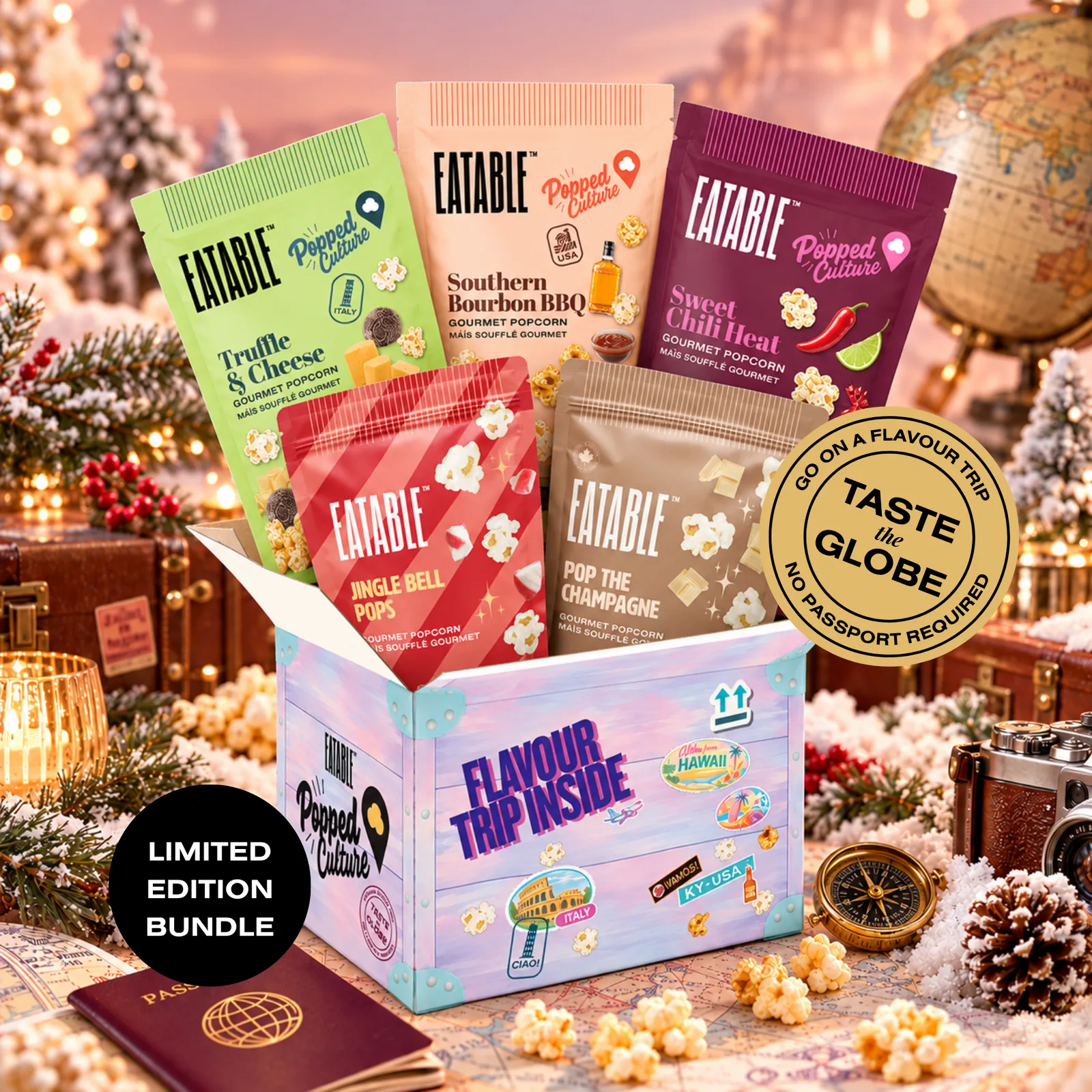 Five colorful bags of EATABLE gourmet popcorn standing in an open gift box printed with the words Flavour Trip Inside, surrounded by travel props