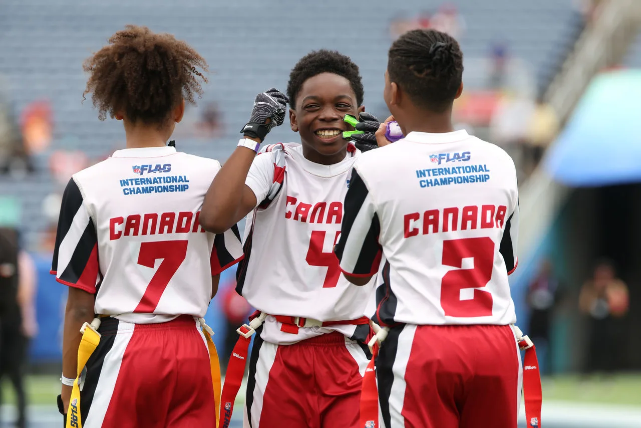 Players competing at the International NFL Flag Championships in a press photo