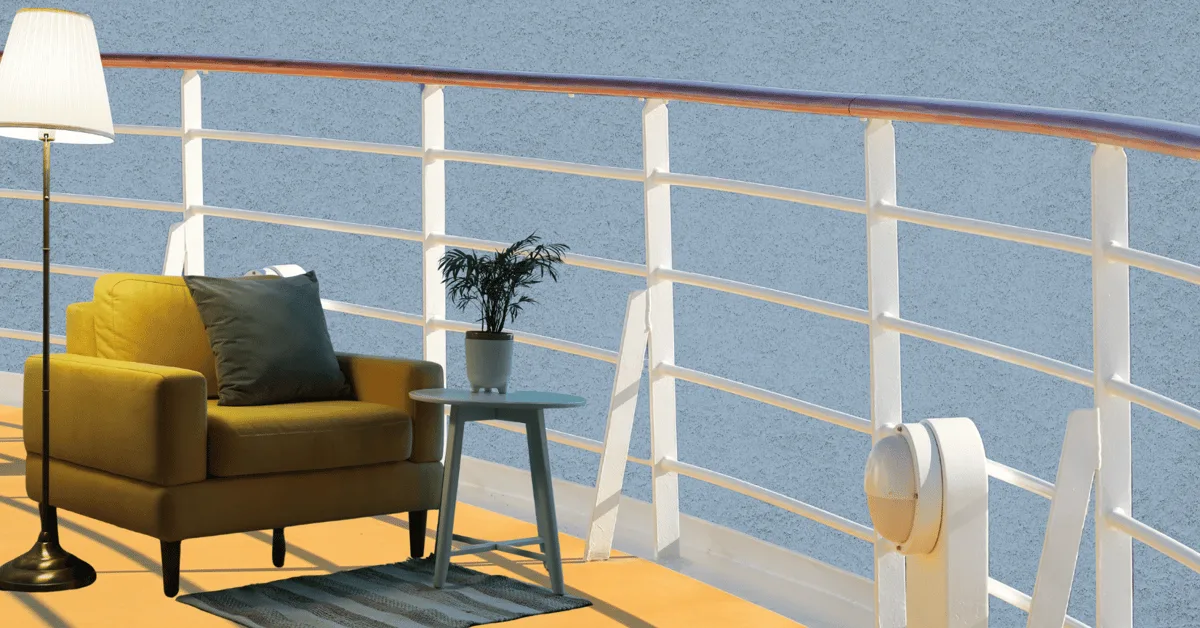 A furnished cruise ship deck with a yellow armchair, a side table with a plant, and a floor lamp beside a white railing over the sea